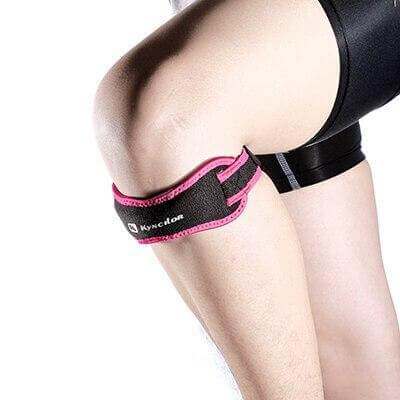 Adjustable knee patella protector worn on a leg for workout safety and support during intense exercise.